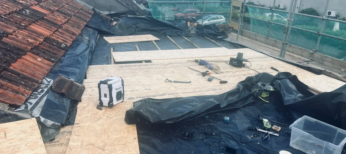 New OSB roof deck being laid over a damp proof membrane