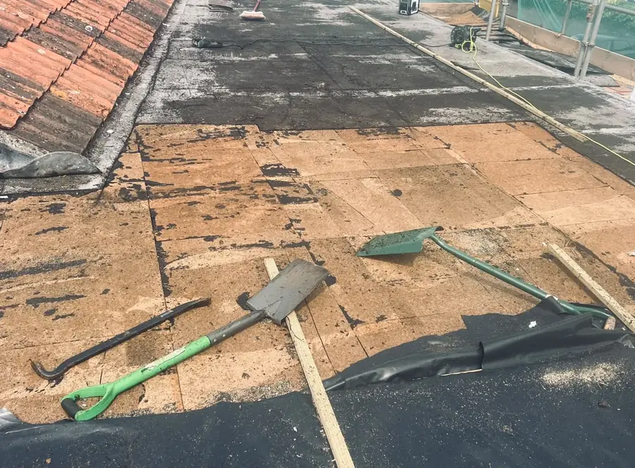 Old flat roof stripped back to the existing timber deck
